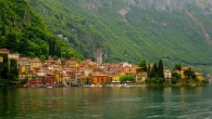 Greetings From… Varenna, Italy Nestled between the rugged foothills of the Alps and the deep, cerulean waters of Lake Como lies the comune of Varenna, Italy. Only an hour’s journey north of Milan, Varenna’s idyllic natural setting has drawn visitors from the bustle of the big city for centuries. Evocative old buildings in shades of ochre, umber, and saffron line Varenna’s labyrinthine cobblestone alleyways. Poking high above the terracotta-tiled roofline...